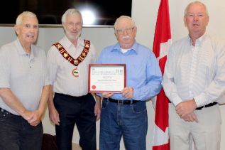North Frontenac’s Senior of the Year, Terry Good (third from left) was honoured at Council Friday morning. Good was cited for his work with Harlowe Hall since he was 10 years old. “It was a two-room schoolhouse when I started,” he said. Good was presented with a fruit basket and is pictured with Dep. Mayor Fred Perry, Mayor Ron Higgins and Coun. Wayne Good. Good and Perry represent Good’s district. Photo/Craig Bakay